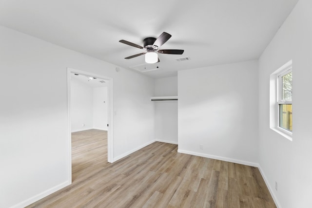 unfurnished room featuring ceiling fan and light wood-type flooring