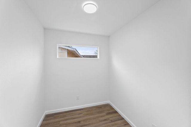 spare room with dark hardwood / wood-style flooring