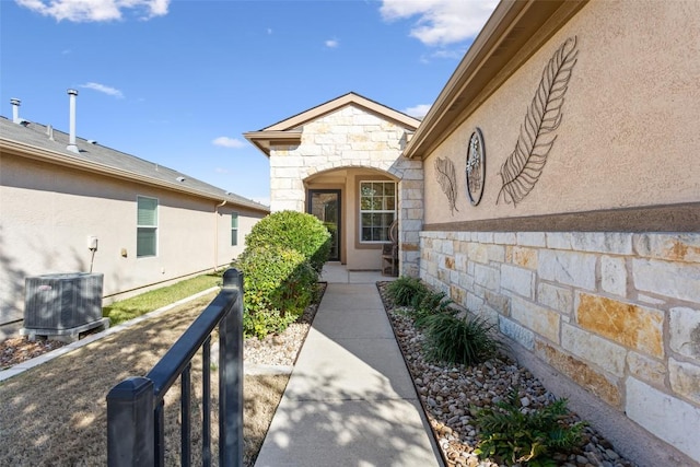 entrance to property featuring central AC