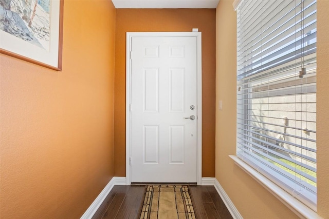 doorway to outside with hardwood / wood-style floors