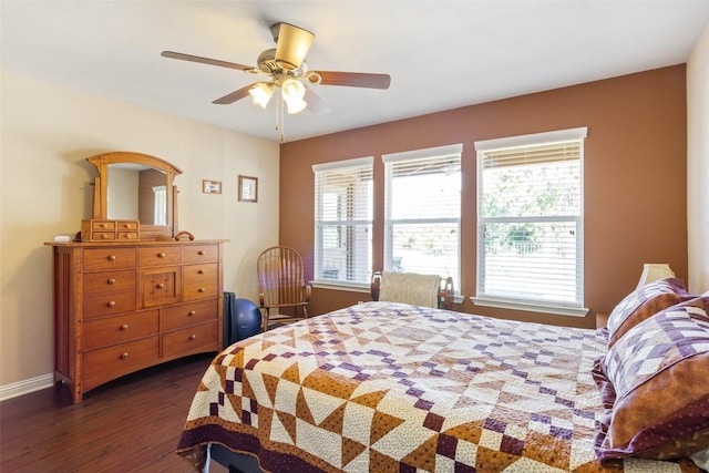 bedroom with dark wood-type flooring and ceiling fan