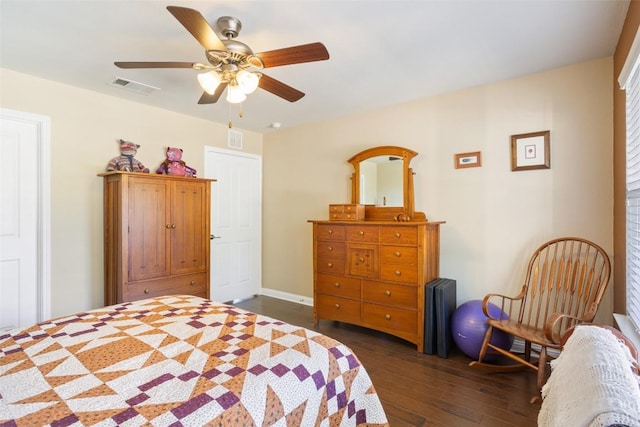 bedroom featuring ceiling fan and dark hardwood / wood-style flooring