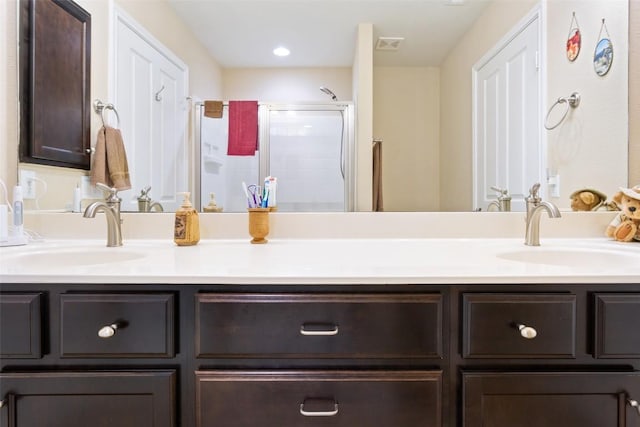 bathroom with vanity and an enclosed shower