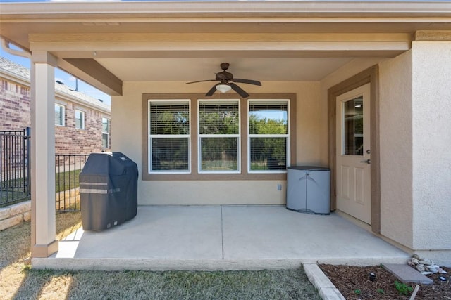 view of patio featuring ceiling fan and a grill