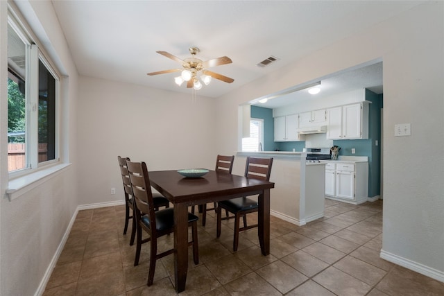 dining area featuring light tile patterned floors and ceiling fan