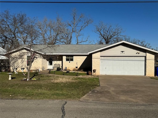 view of front of property featuring a garage and a front yard