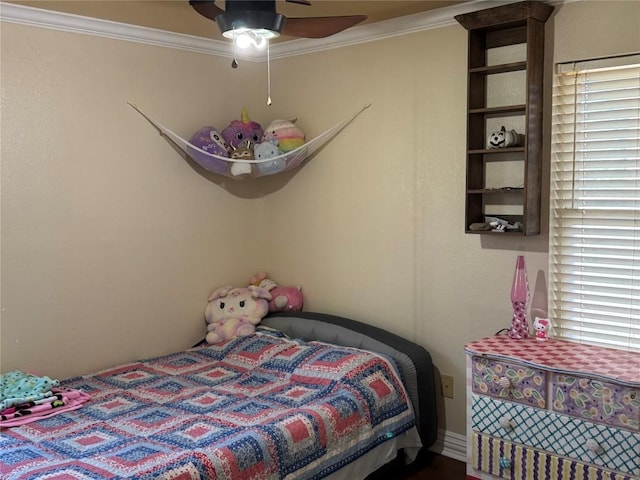 bedroom featuring ceiling fan and crown molding