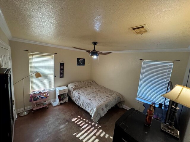 bedroom featuring baseboards, visible vents, a ceiling fan, ornamental molding, and a textured ceiling