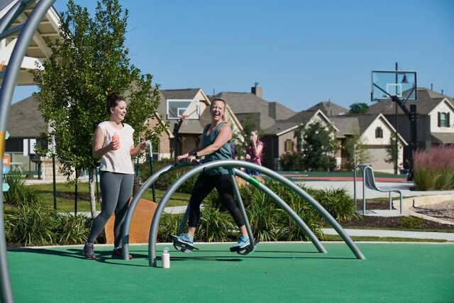 232 Flora Springs Cv, Liberty Hill, TX 78642 - view of play area featuring a residential view