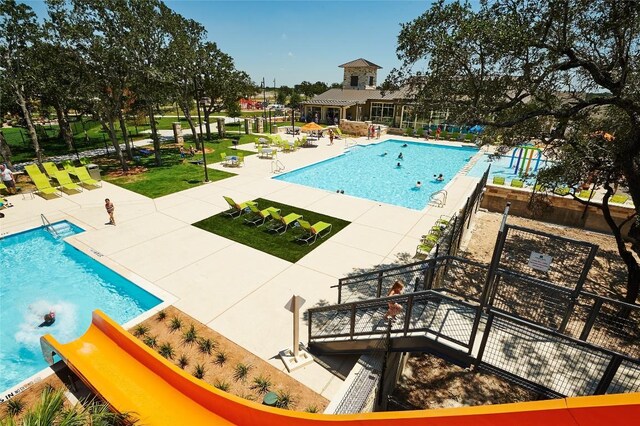 232 Flora Springs Cv, Liberty Hill, TX 78642 - community pool with a patio and fence
