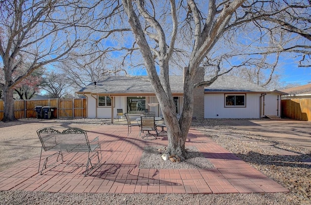 rear view of house with a patio