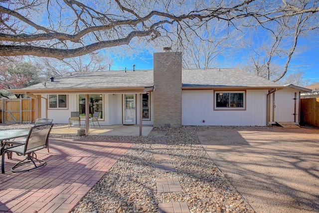 back of property featuring a patio area