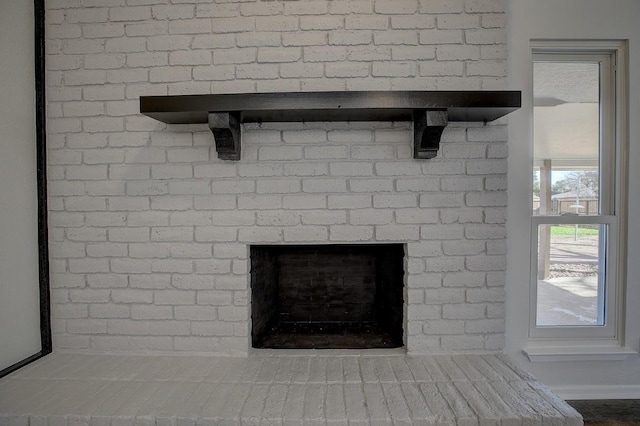 room details featuring a brick fireplace