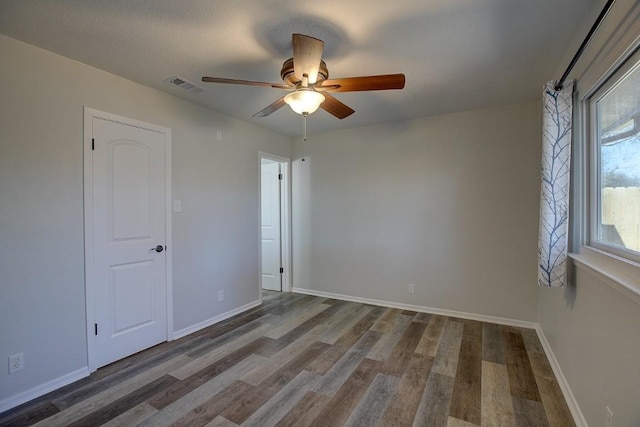 unfurnished room featuring wood-type flooring and ceiling fan