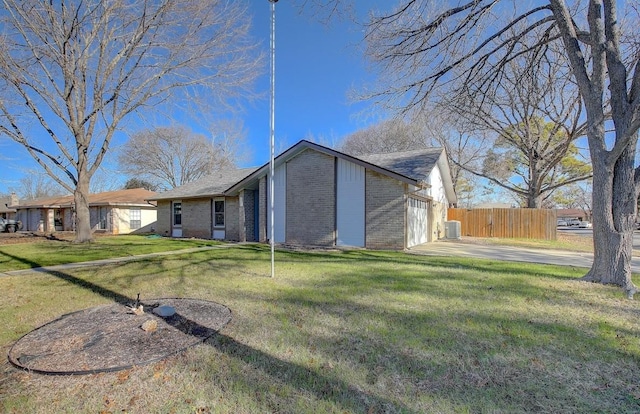 back of property featuring a lawn