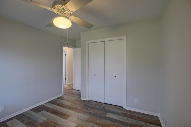 unfurnished bedroom with wood-type flooring, a closet, and ceiling fan