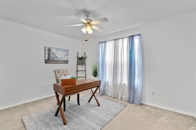 home office with light colored carpet and ceiling fan