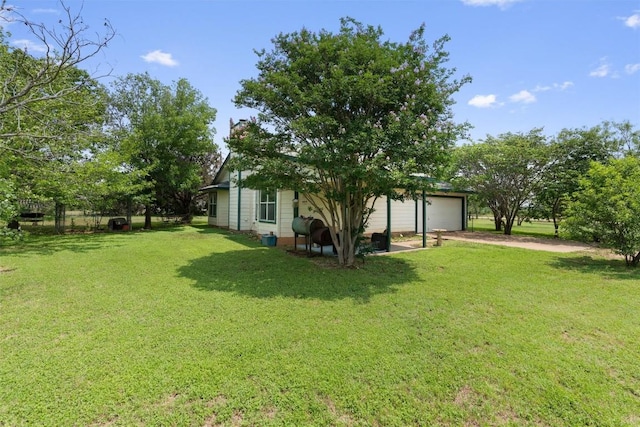 view of yard with a garage