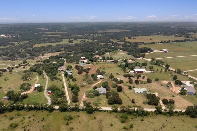 birds eye view of property with a rural view