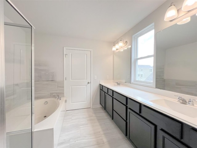 bathroom with vanity and separate shower and tub