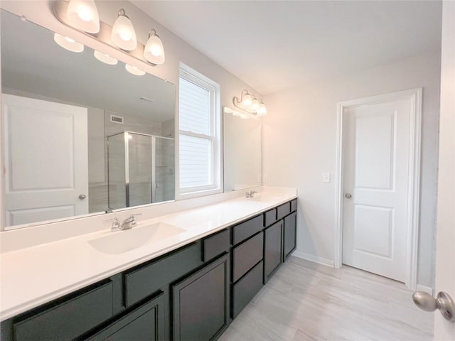 bathroom with vanity and walk in shower