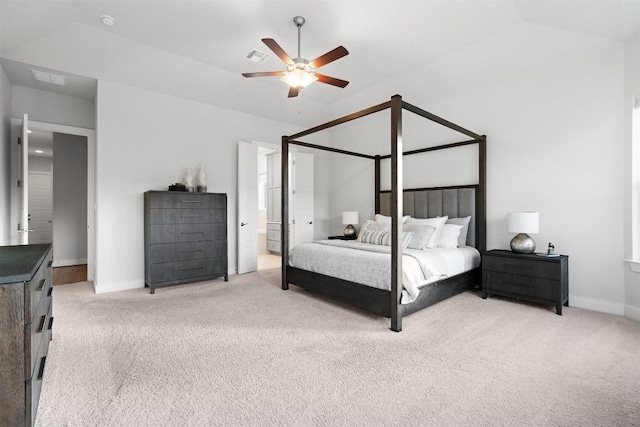 bedroom featuring light colored carpet, visible vents, connected bathroom, ceiling fan, and baseboards