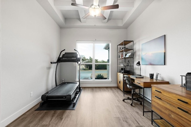 office area with ceiling fan, baseboards, and wood finished floors