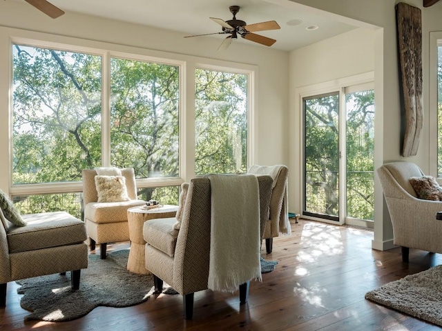 sunroom / solarium featuring a wealth of natural light and ceiling fan