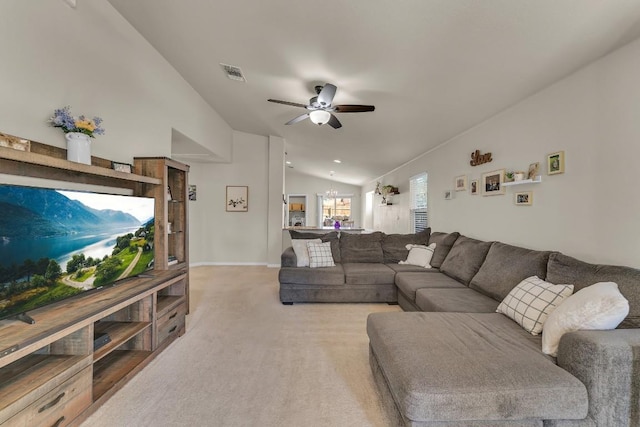 carpeted living room featuring ceiling fan and lofted ceiling