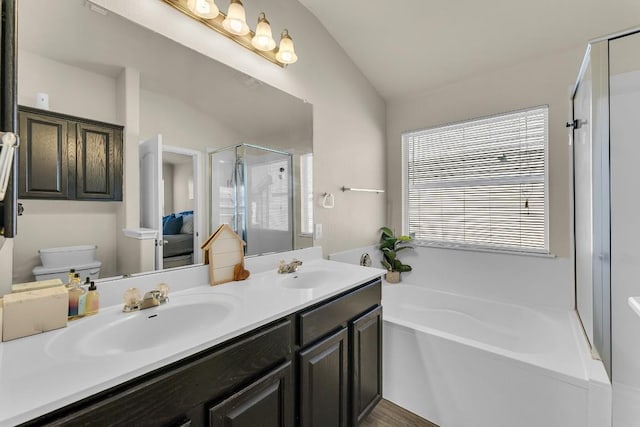 full bathroom with lofted ceiling, toilet, independent shower and bath, and vanity