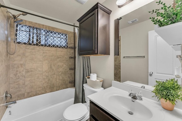 full bathroom with vanity, shower / tub combo with curtain, and toilet