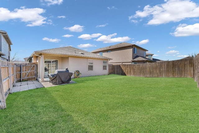 rear view of property with a yard