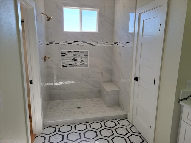 bathroom with tiled shower