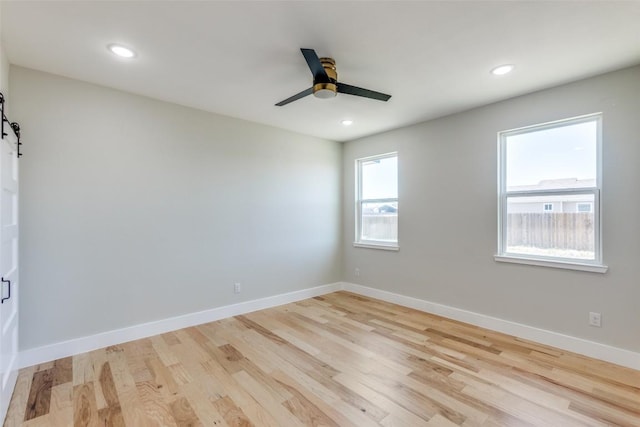 unfurnished room featuring a ceiling fan, baseboards, recessed lighting, and light wood finished floors