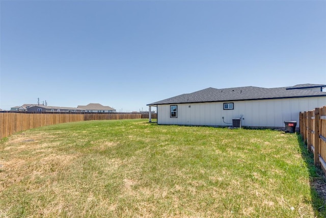view of yard with cooling unit and a fenced backyard