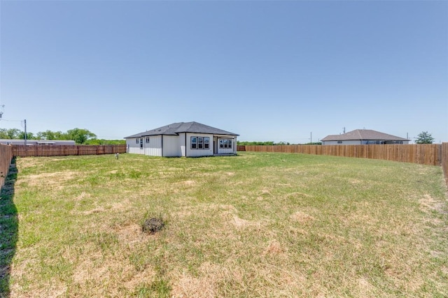 view of yard featuring a fenced backyard
