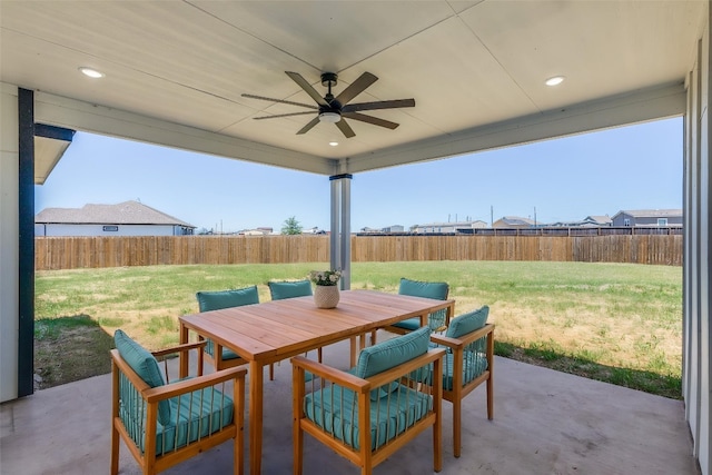 view of patio featuring a fenced backyard, outdoor dining space, and ceiling fan