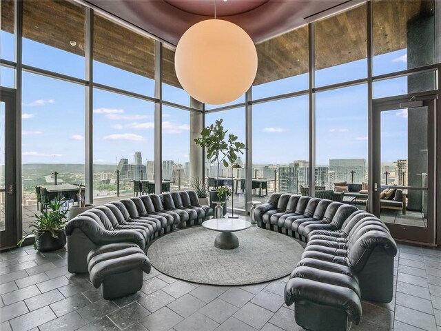 44 E Ave Unit 1407, Austin, TX 78701 - living area featuring a skyline view and expansive windows