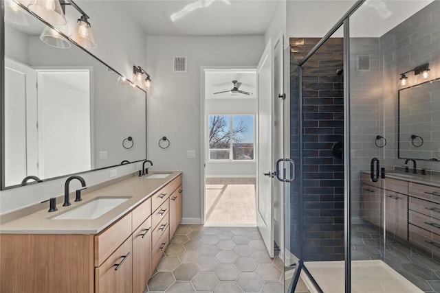 bathroom with vanity, an enclosed shower, tile patterned flooring, and ceiling fan