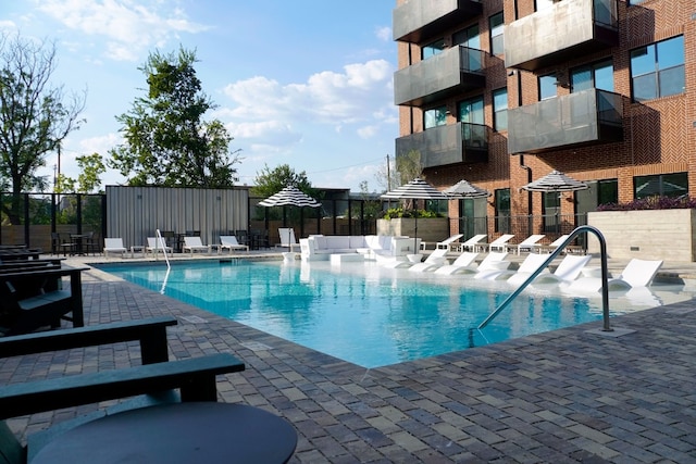 view of swimming pool with a patio area