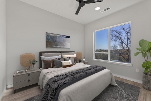 bedroom featuring hardwood / wood-style floors and ceiling fan