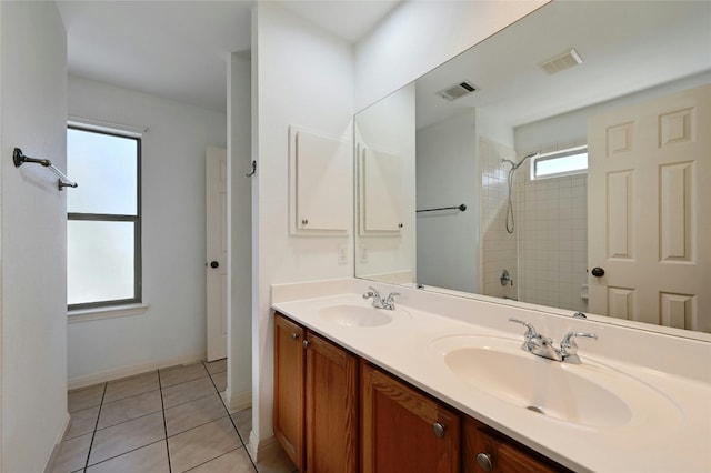 bathroom with tile patterned flooring and vanity