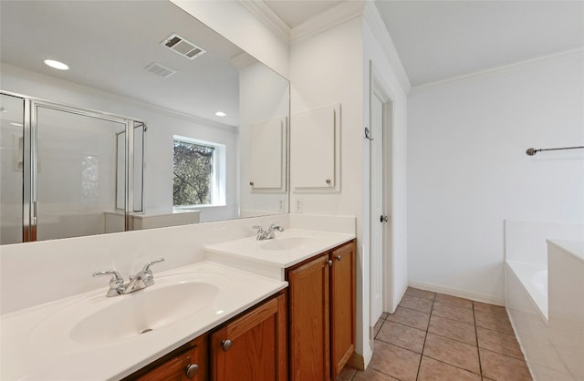 bathroom featuring tile patterned flooring, crown molding, shower with separate bathtub, and vanity