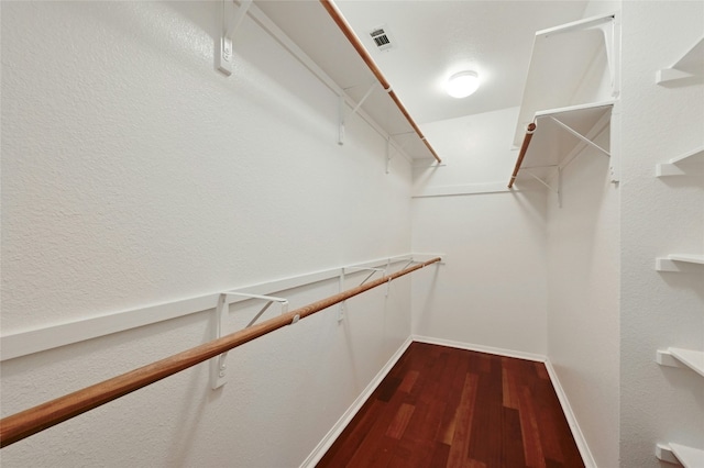 spacious closet featuring hardwood / wood-style flooring