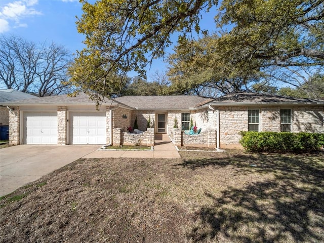 single story home featuring a garage and a front lawn