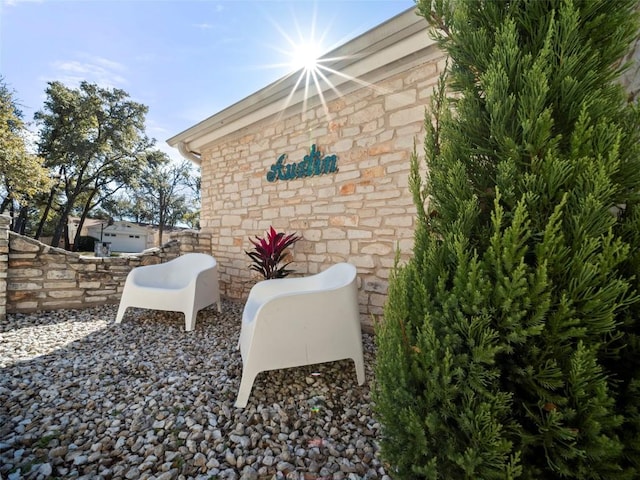 exterior space featuring stone siding