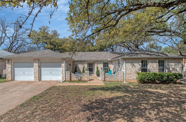 single story home with a garage, a front yard, concrete driveway, and roof with shingles