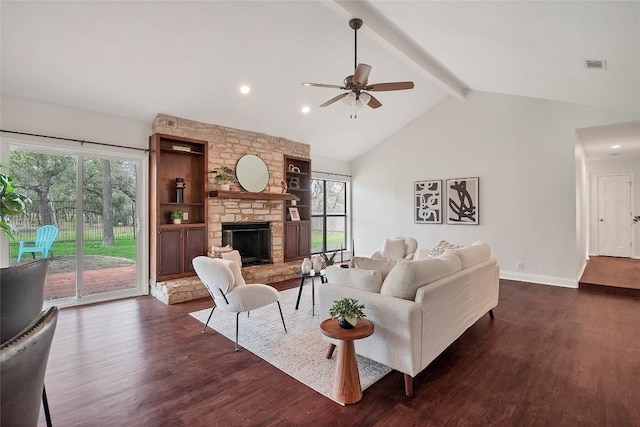 living area with dark wood-type flooring, beam ceiling, visible vents, and a stone fireplace