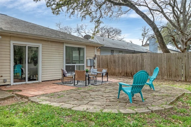 view of patio featuring fence