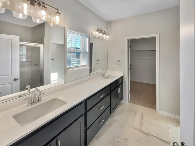 bathroom featuring vanity and an enclosed shower